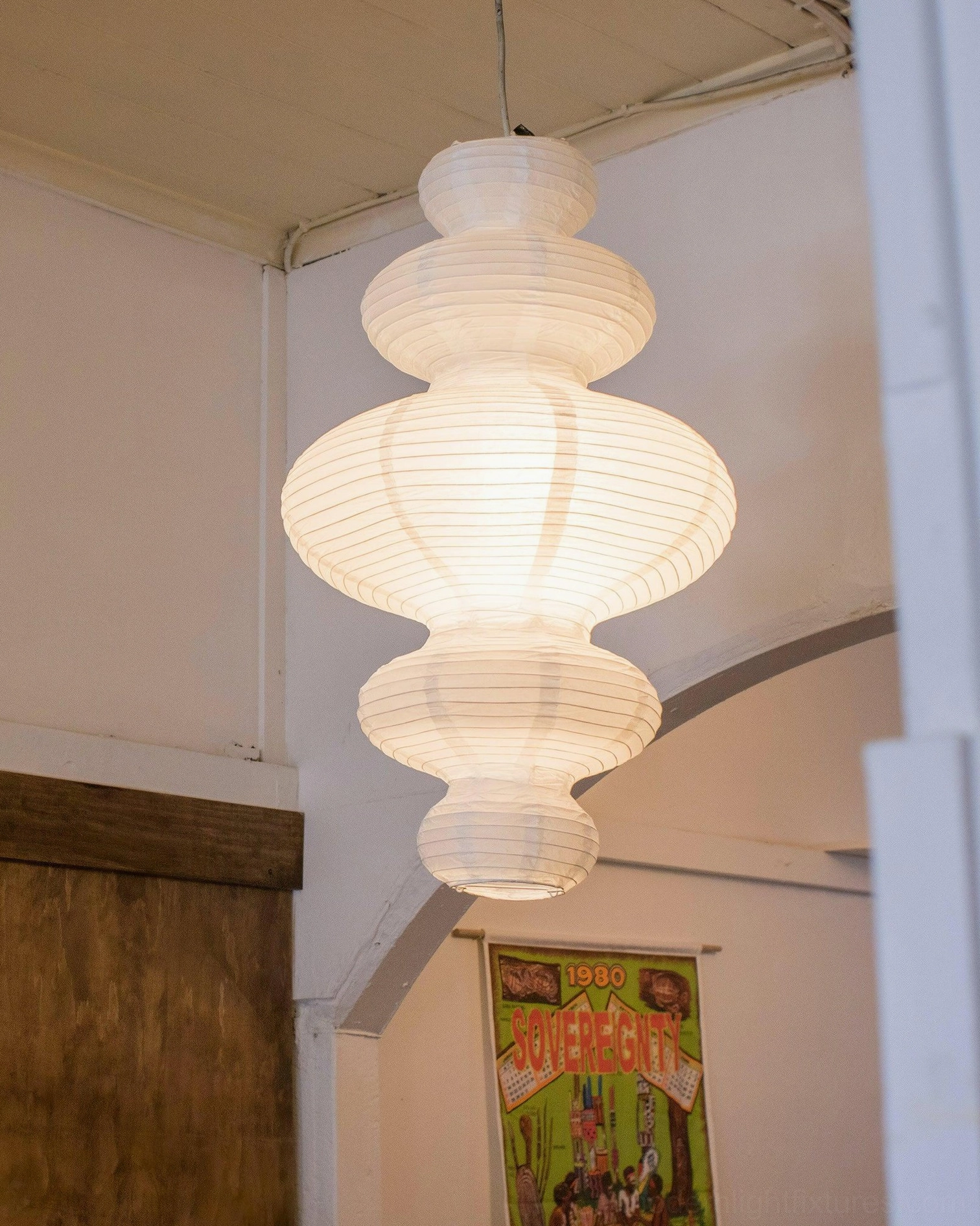 Modern pendant lamp with adjustable cord showing height customization options for different ceiling heights