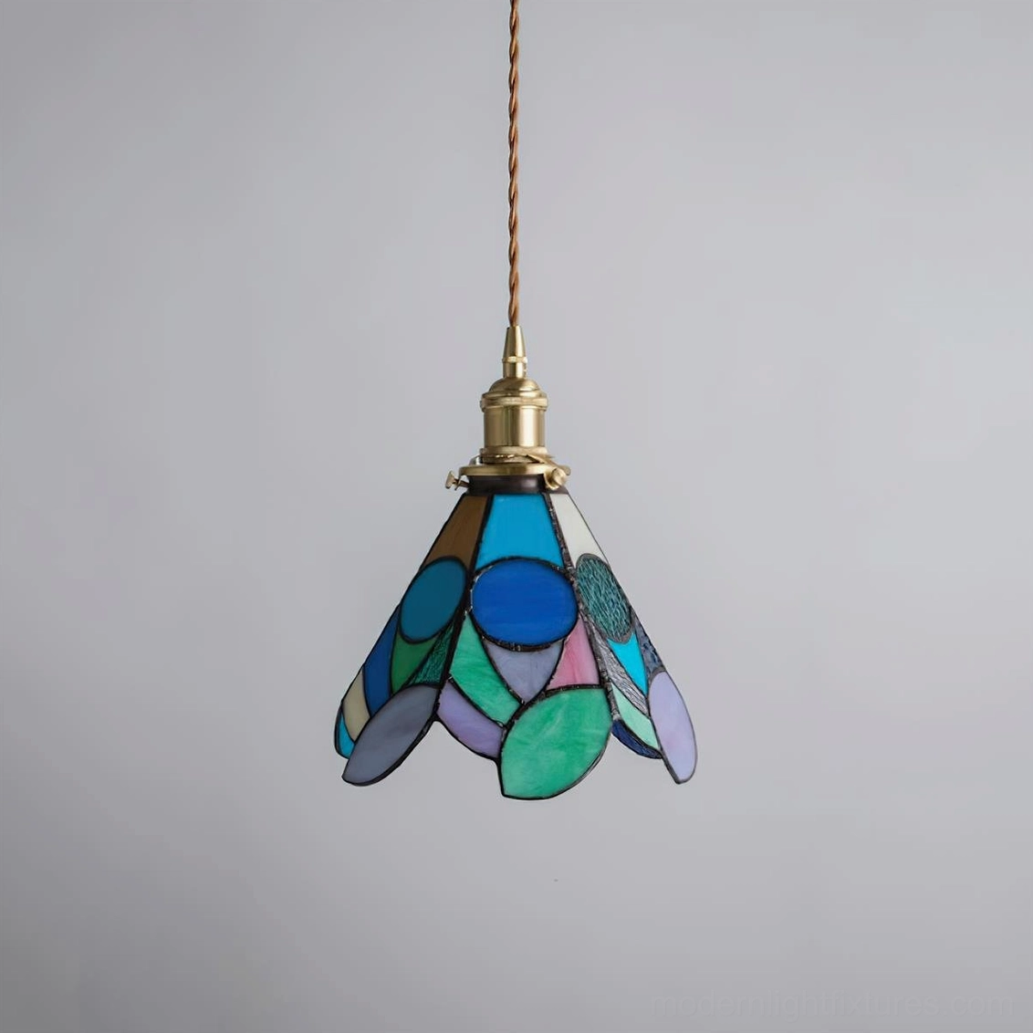 Pendant lamp with hand-cut stained glass shade in floral motif complementing transitional home decor