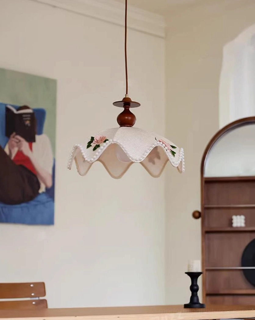 Cream fabric pendant light shade with pearled scalloped edge and floral embroidery closeup