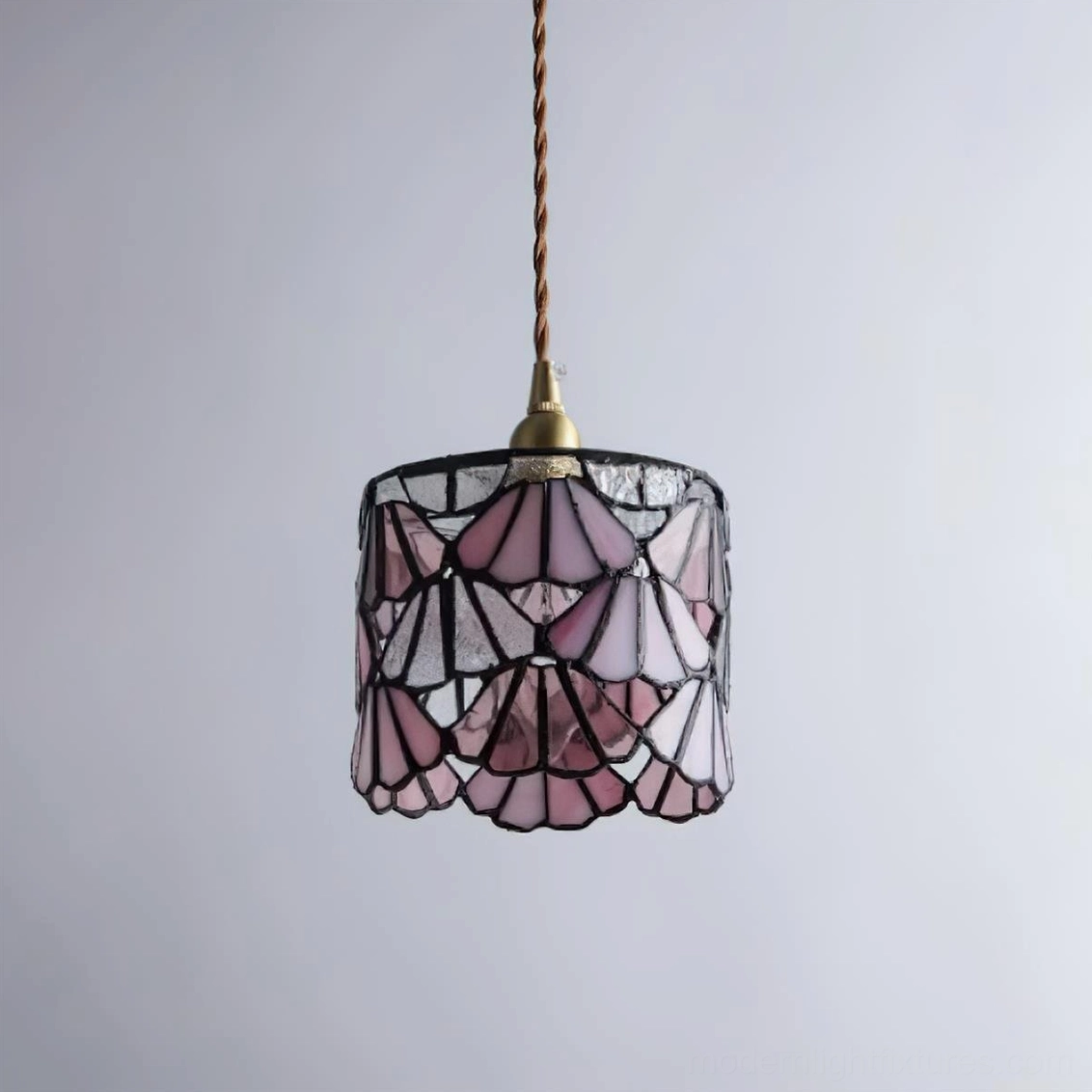 Stained glass pendant light installation on sloped ceiling showing adjustable canopy compatibility