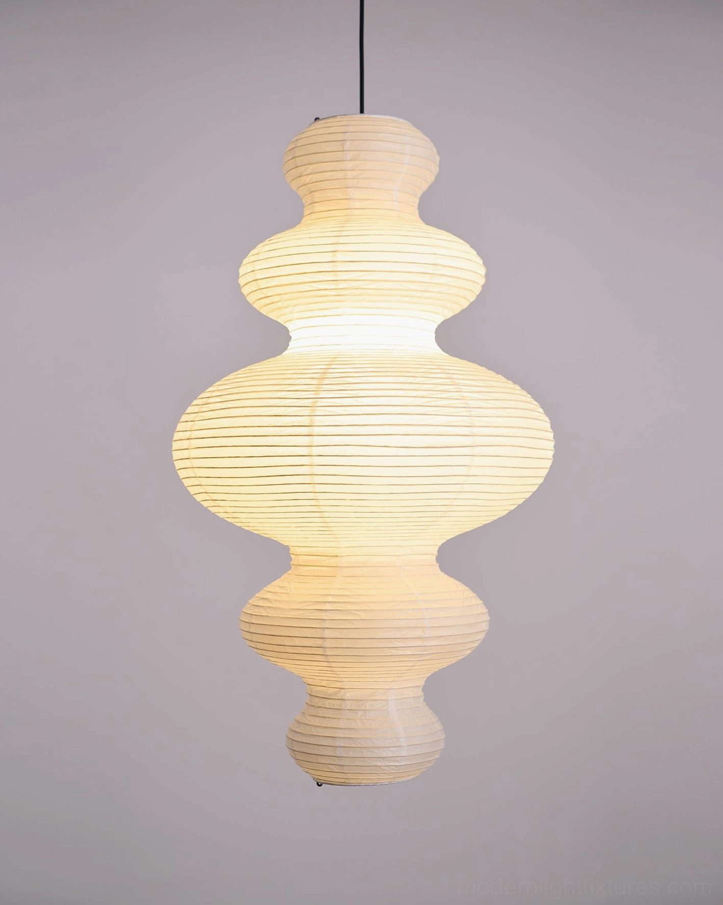 Contemporary pendant lamp creating warm soft directionless glow across entire room without harsh center