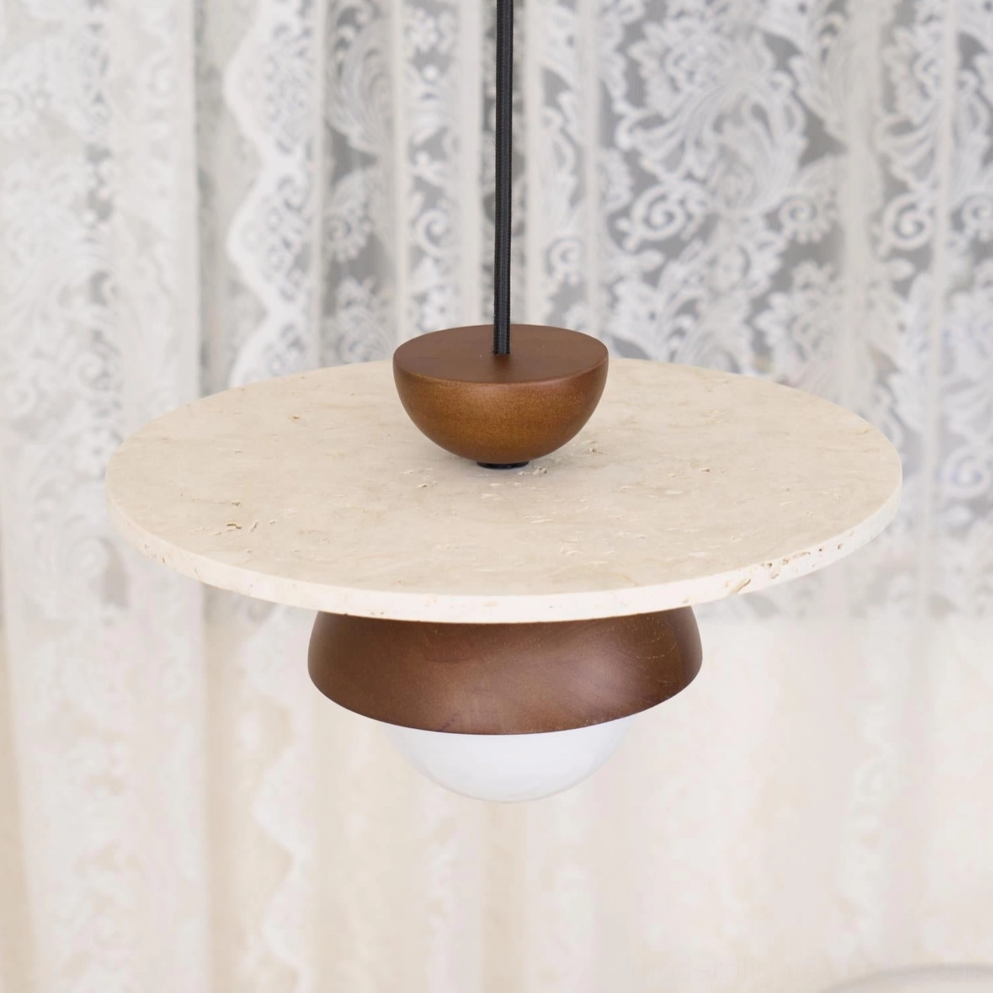 Travertine pendant light installation showing adjustable wire length and sloped ceiling compatibility