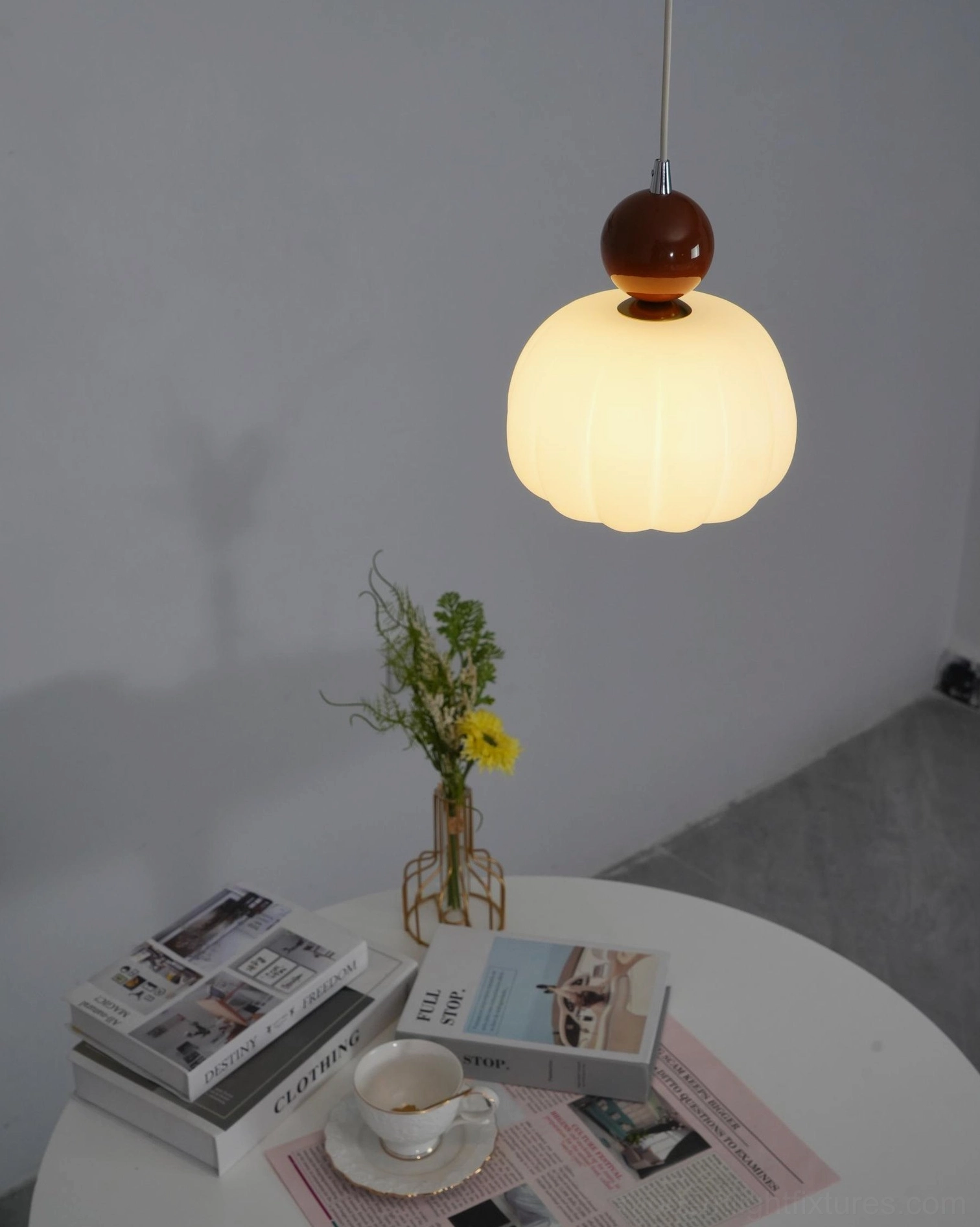 Modern pendant fixture showing light distribution from ribbed acrylic shade - even diffusion overhead