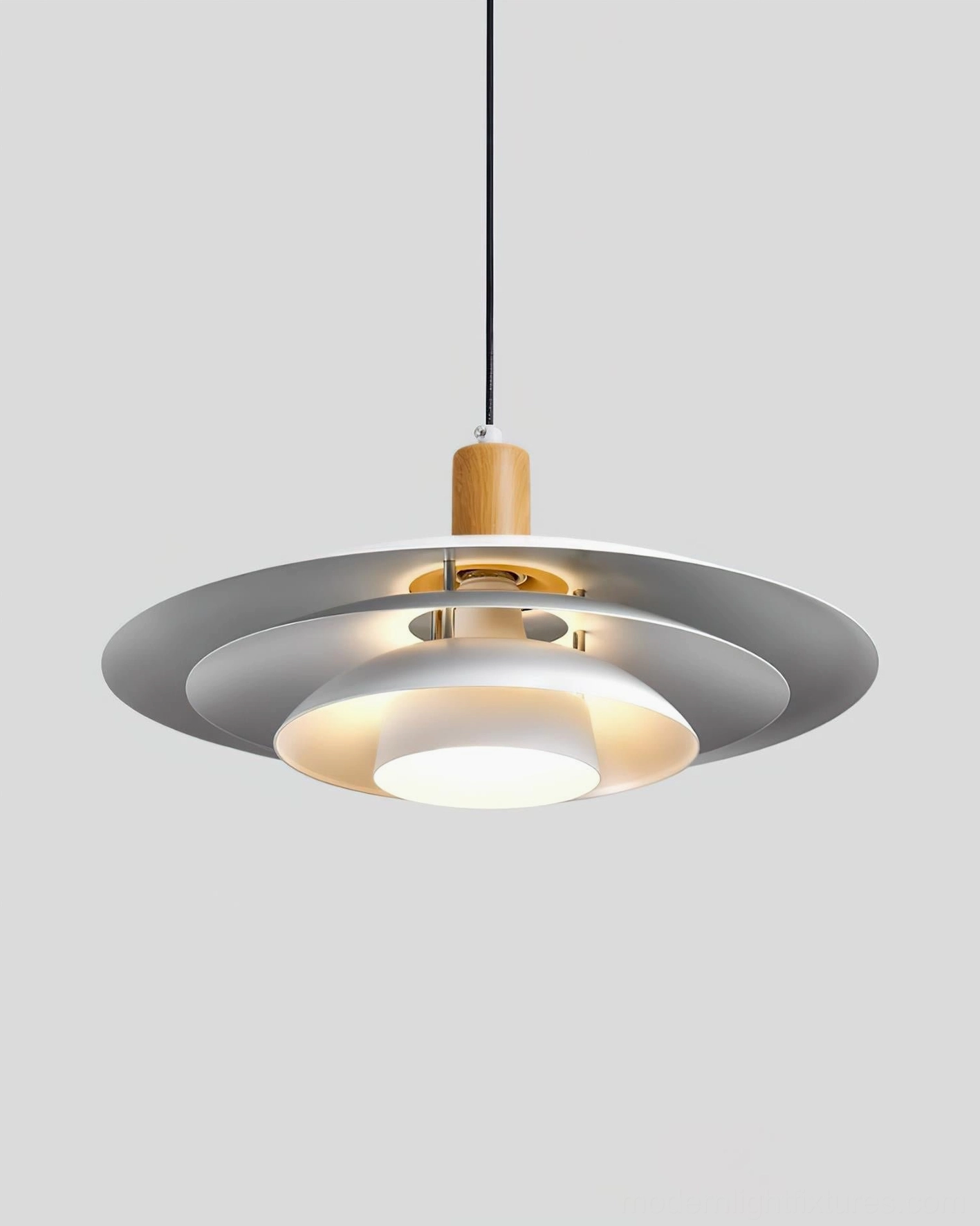 Modern pendant light low angle view with illuminated interior showing grey outer matte finish and wood grain top joint