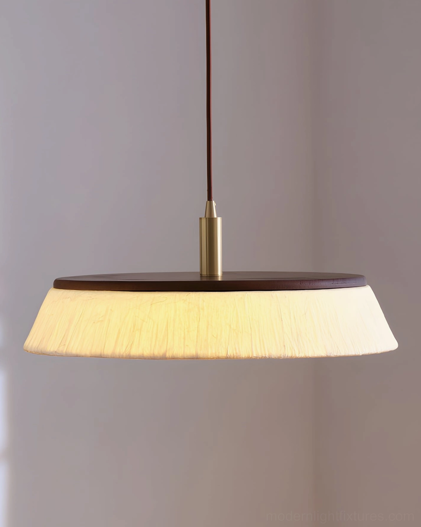 Japandi pendant light hanging in hallway with minimalist decor and neutral wall color, subtle ambient glow