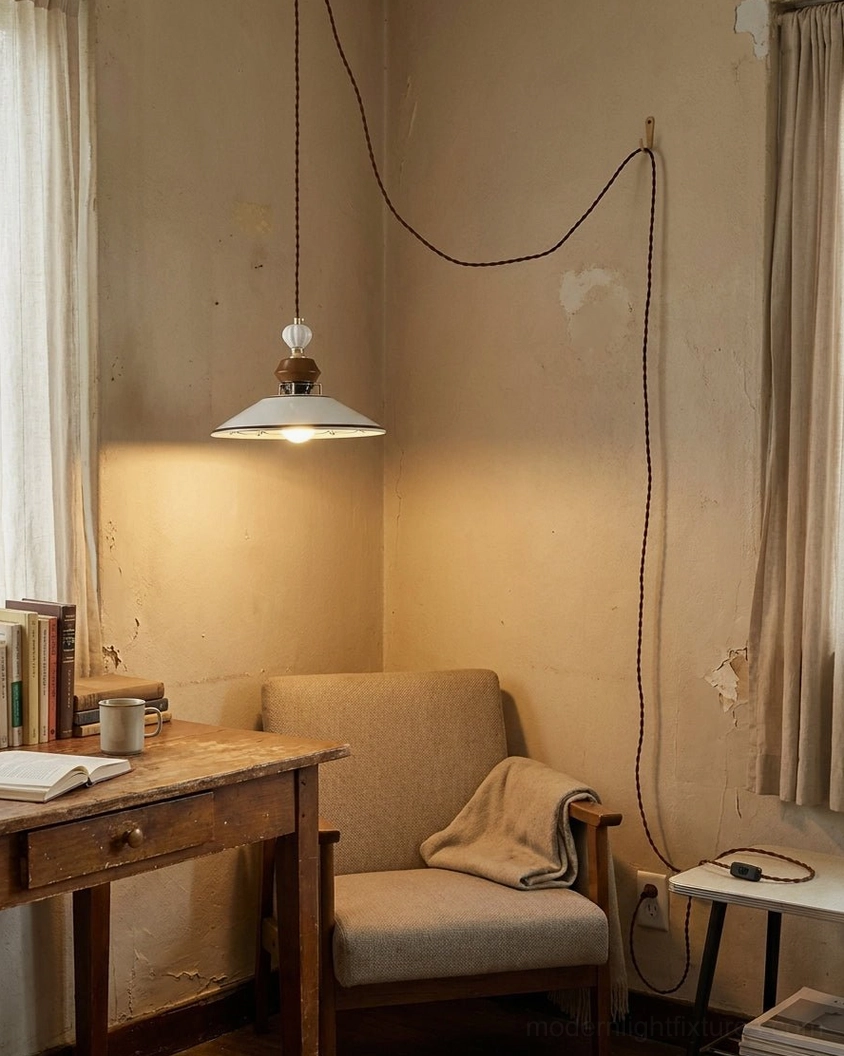 Celine plug-in pendant above wooden desk in home office reading corner with warm ambient light and armchair