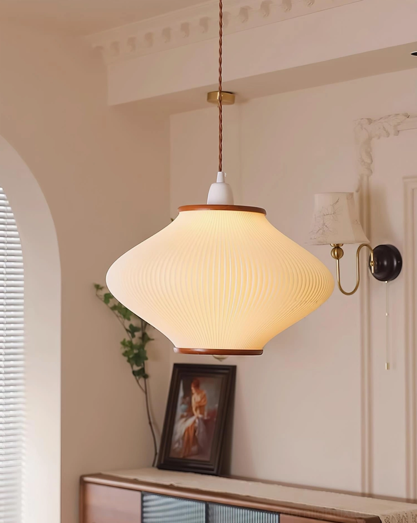 Japanese minimalist pendant fixture installation showing cord adjustment and ceiling mounting capability