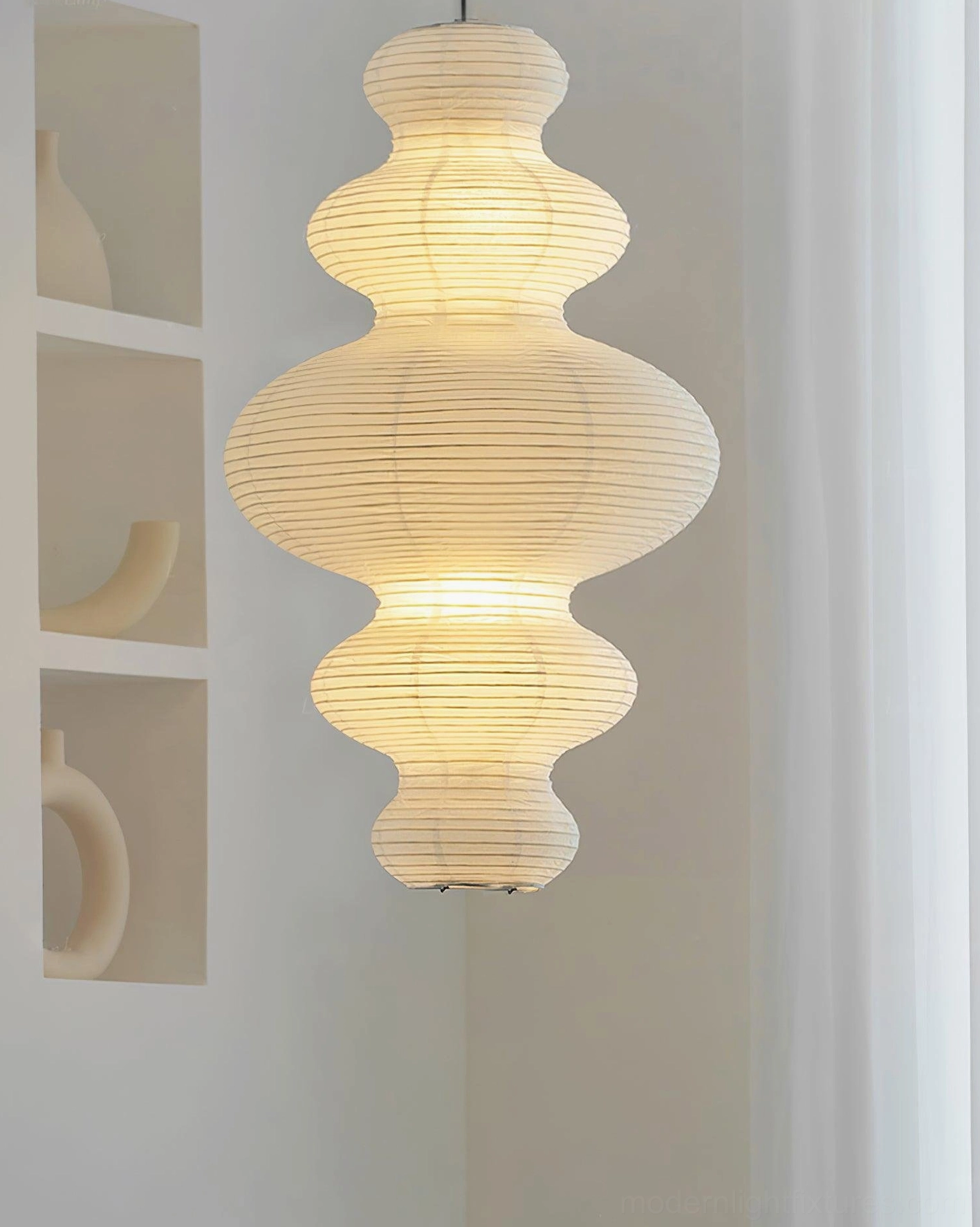 Contemporary pendant light above coffee table as visual anchor in modern living room design
