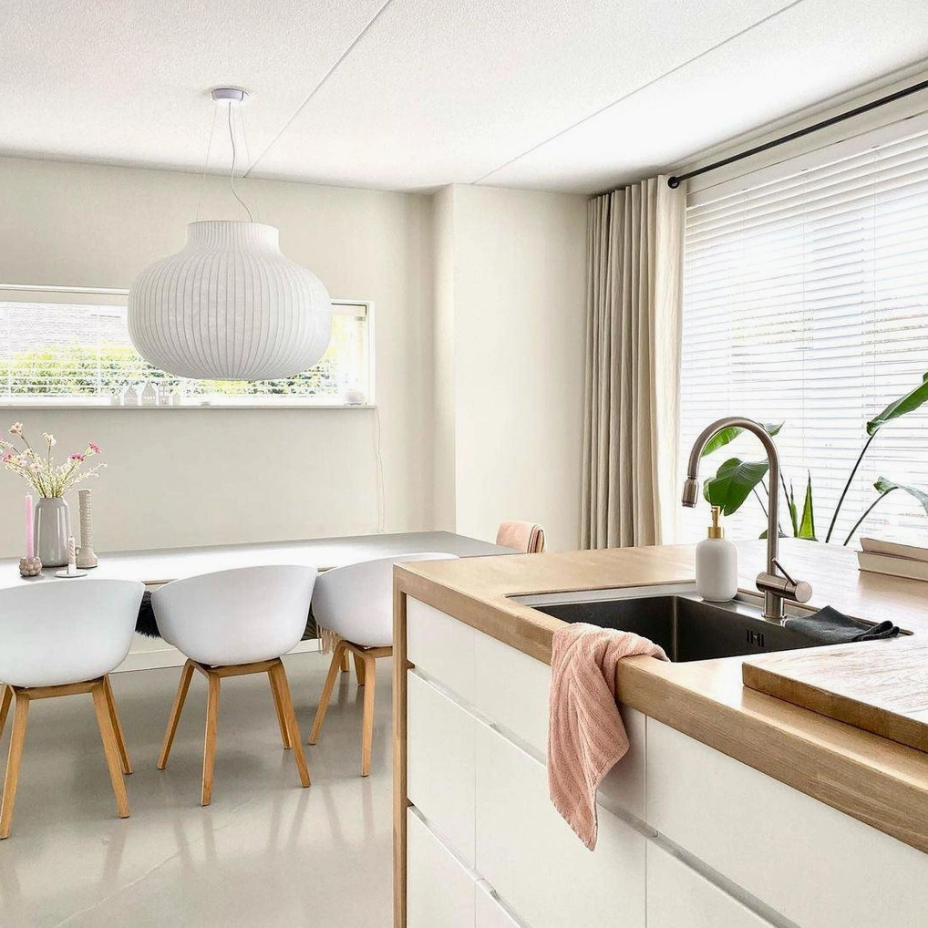 Contemporary pendant light installation showing metal framework and silk shade construction detail