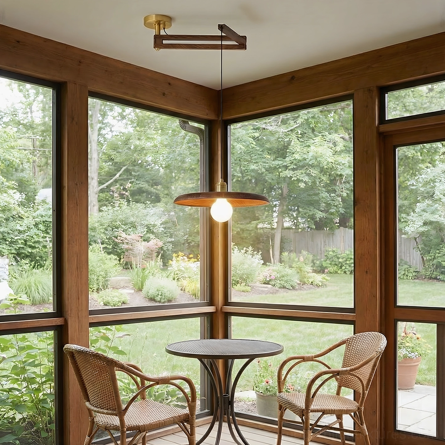 Glass sunroom with bistro furniture and Carlyle wood pendant fixture