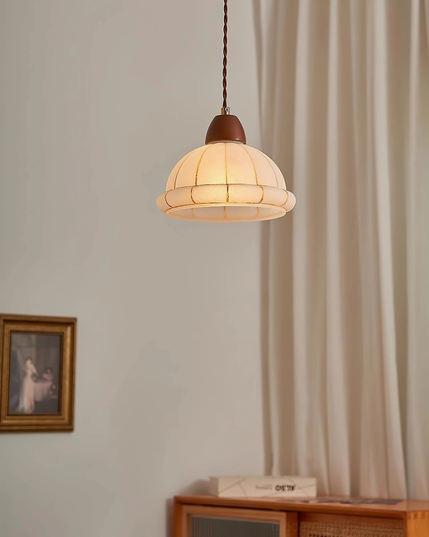 Compact walnut pendant fixture with ribbed shade viewed from high angle in bedroom or living room setting