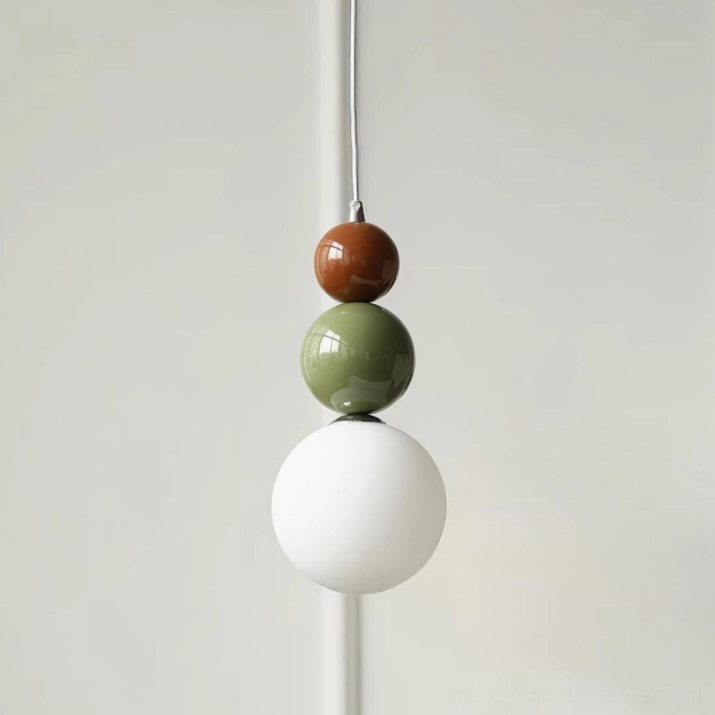 Stacked glass ball pendant light showing metal suspension wire and ceiling mount hardware