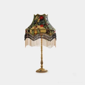 Vintage peony embroidered table lamp with brass base and decorative fringe trim, front view on white background