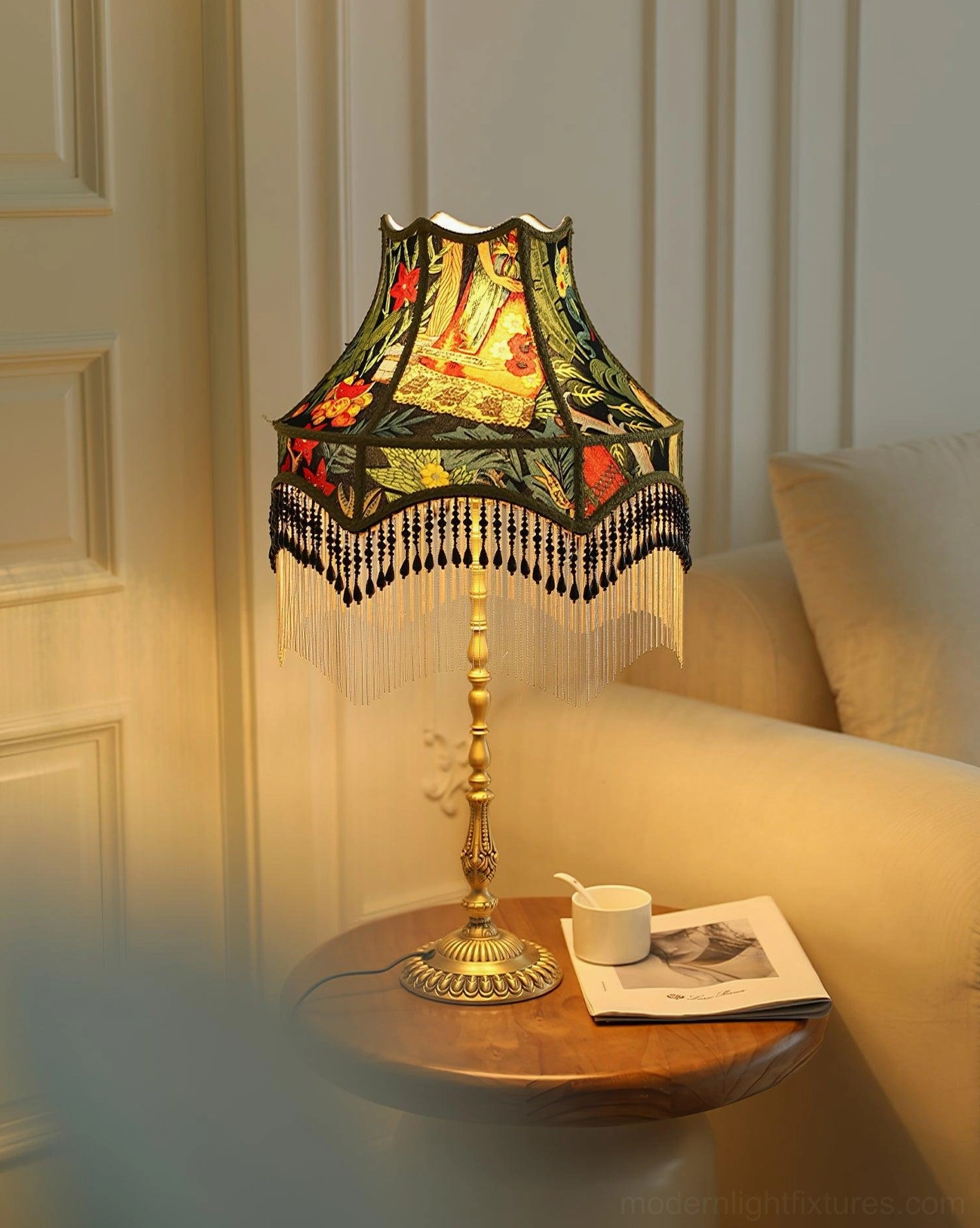 Warm-toned night scene featuring illuminated peony table lamp with magazine and decorative objects