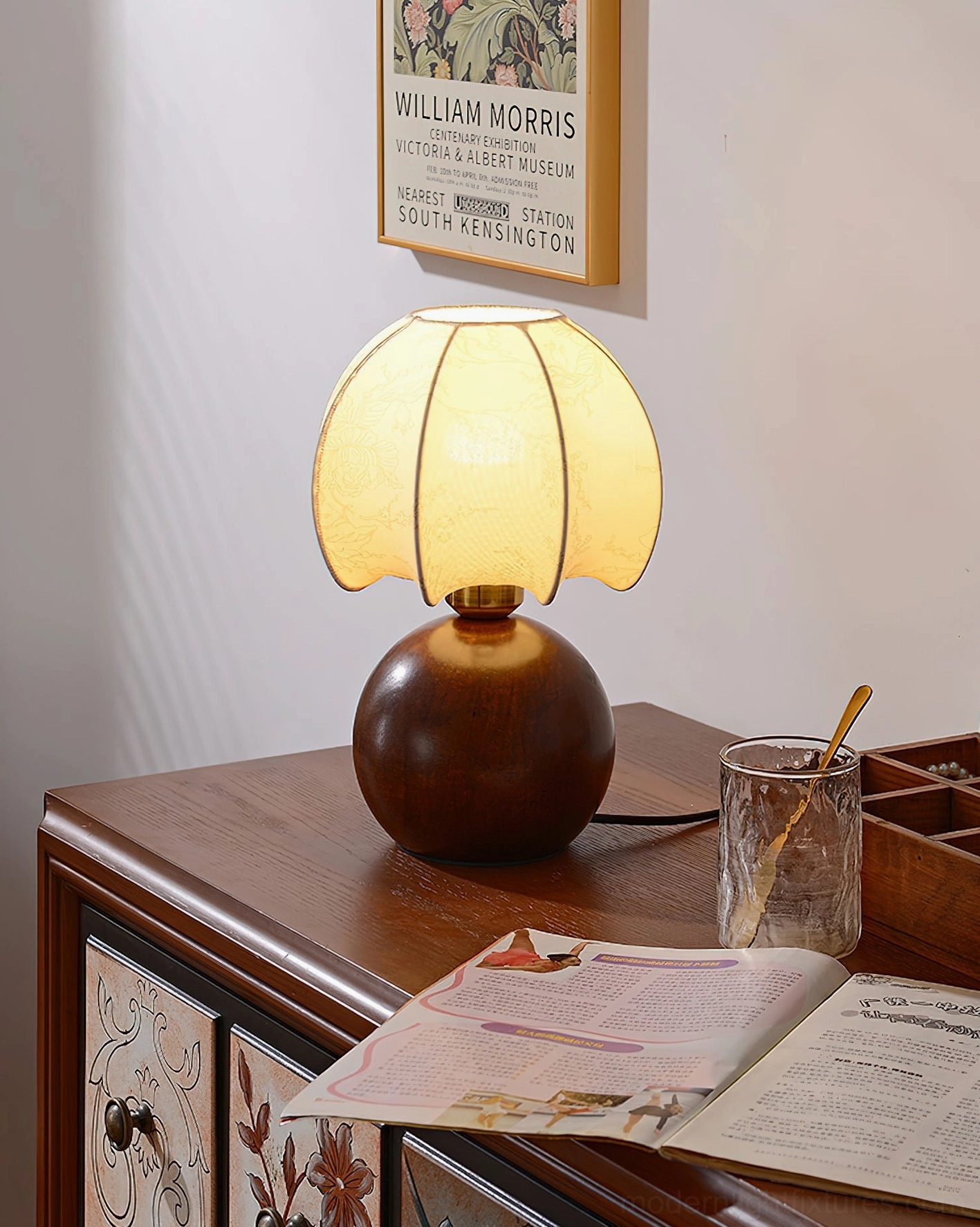 Peony bloom table lamp styled on dresser with decorative accessories and magazine
