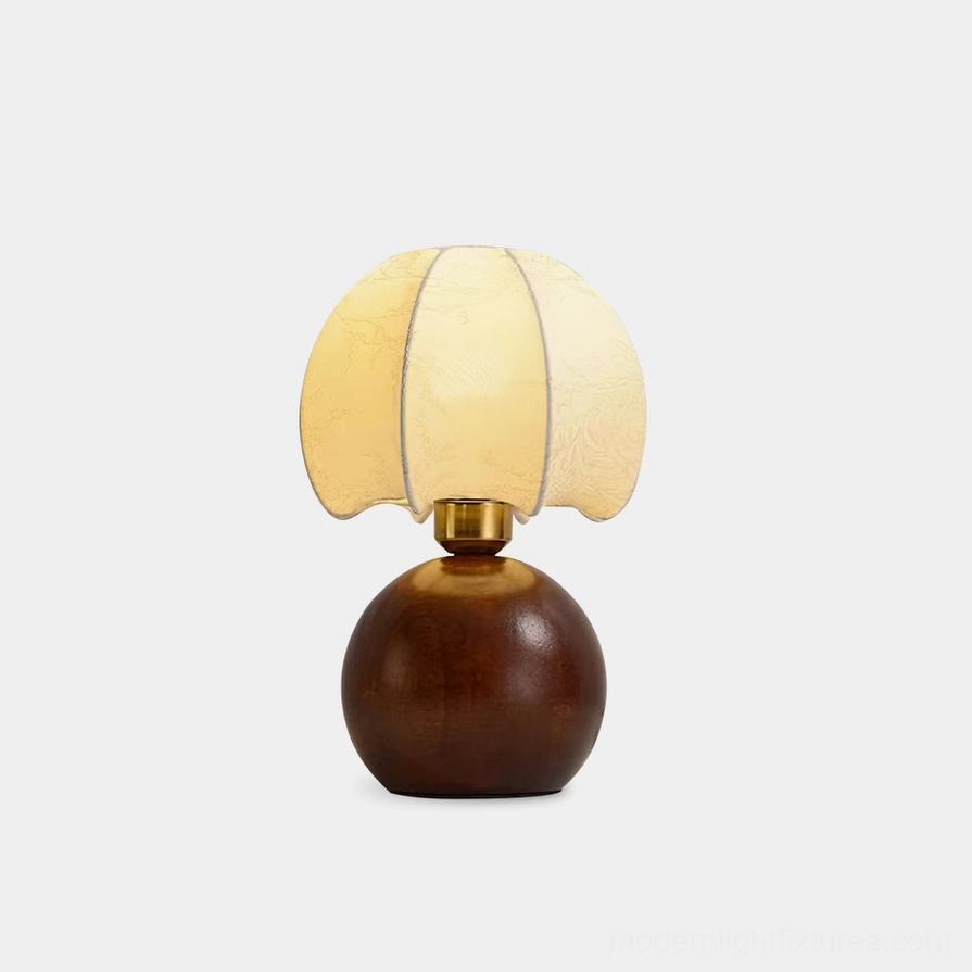 Peony bloom table lamp with scalloped fabric shade and wooden sphere base, front studio view