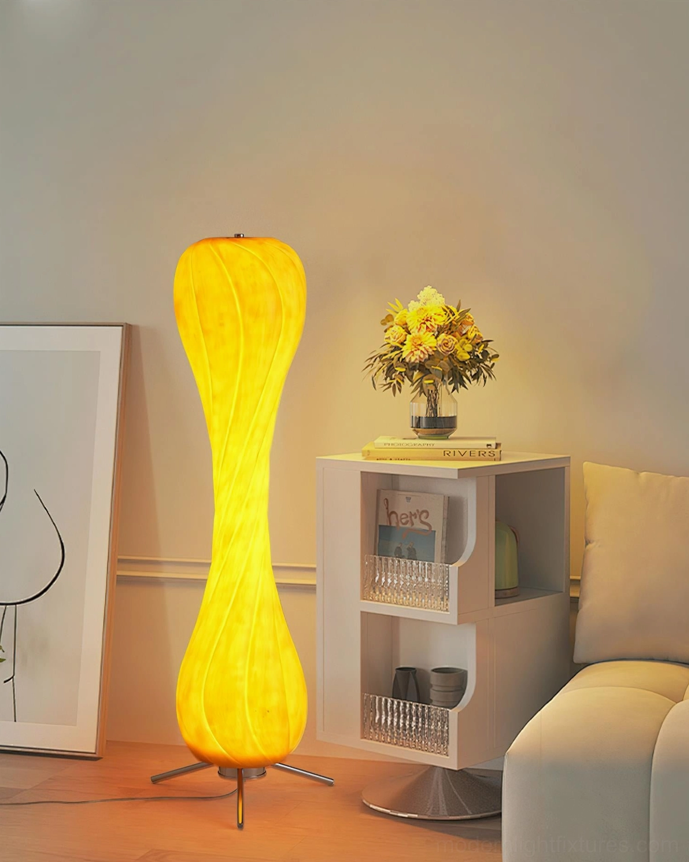 Pepperpod twisted column floor lamp beside modern side table with floral decor and warm ambient lighting
