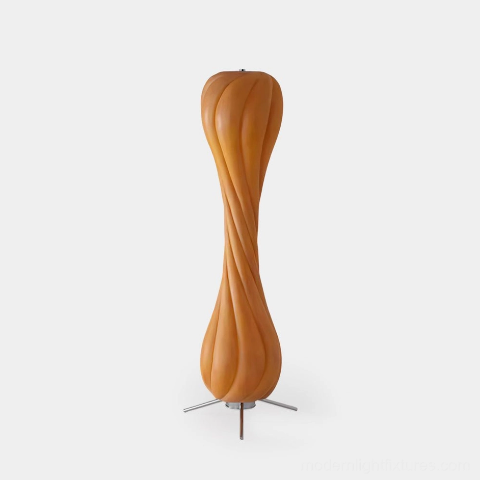 Pepperpod twisted column floor lamp front view with warm textured resin shade and metal tripod base on white background