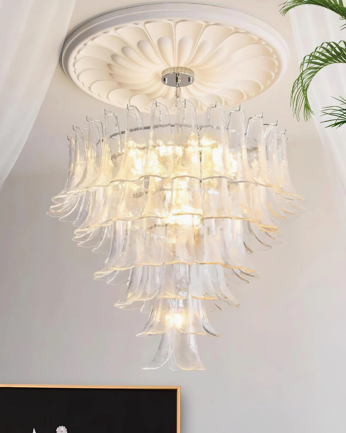 Hand-blown glass petal chandelier with chrome hardware and adjustable chain system detail