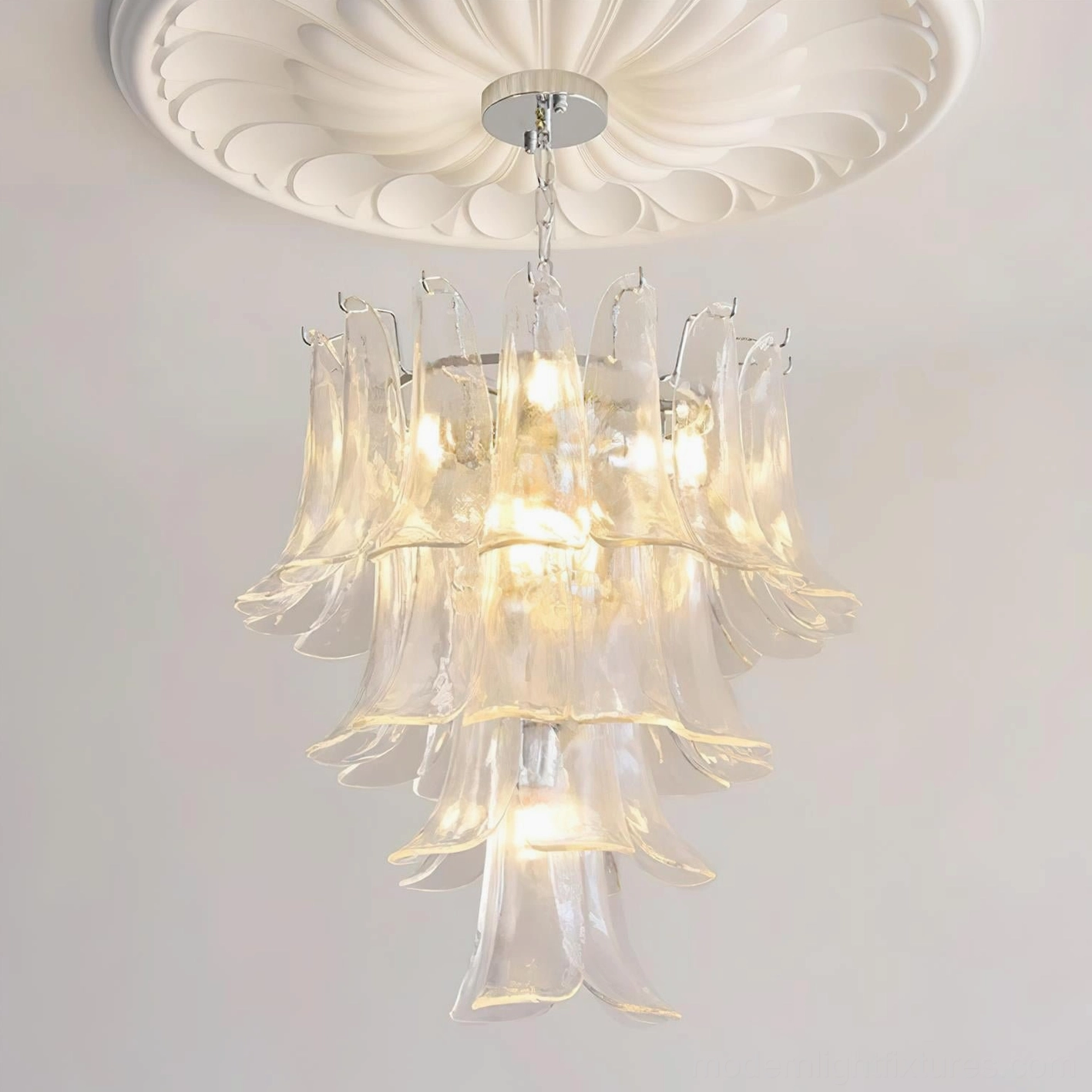 Petal chandelier illuminated showing how hand-blown glass creates unique light distribution patterns