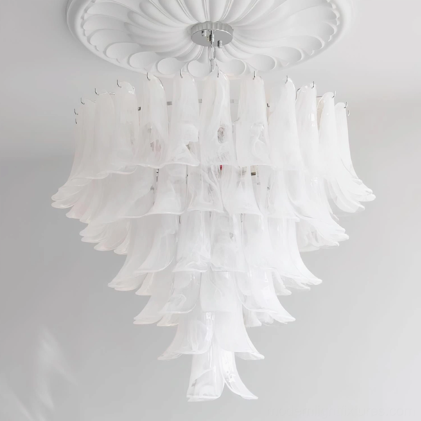 Sculptural glass petal chandelier overhead view illustrating tiered organic form and light paths