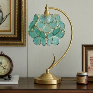 Blue petal table lamp on home office desk with wall art and vintage decor, brass base floral lighting