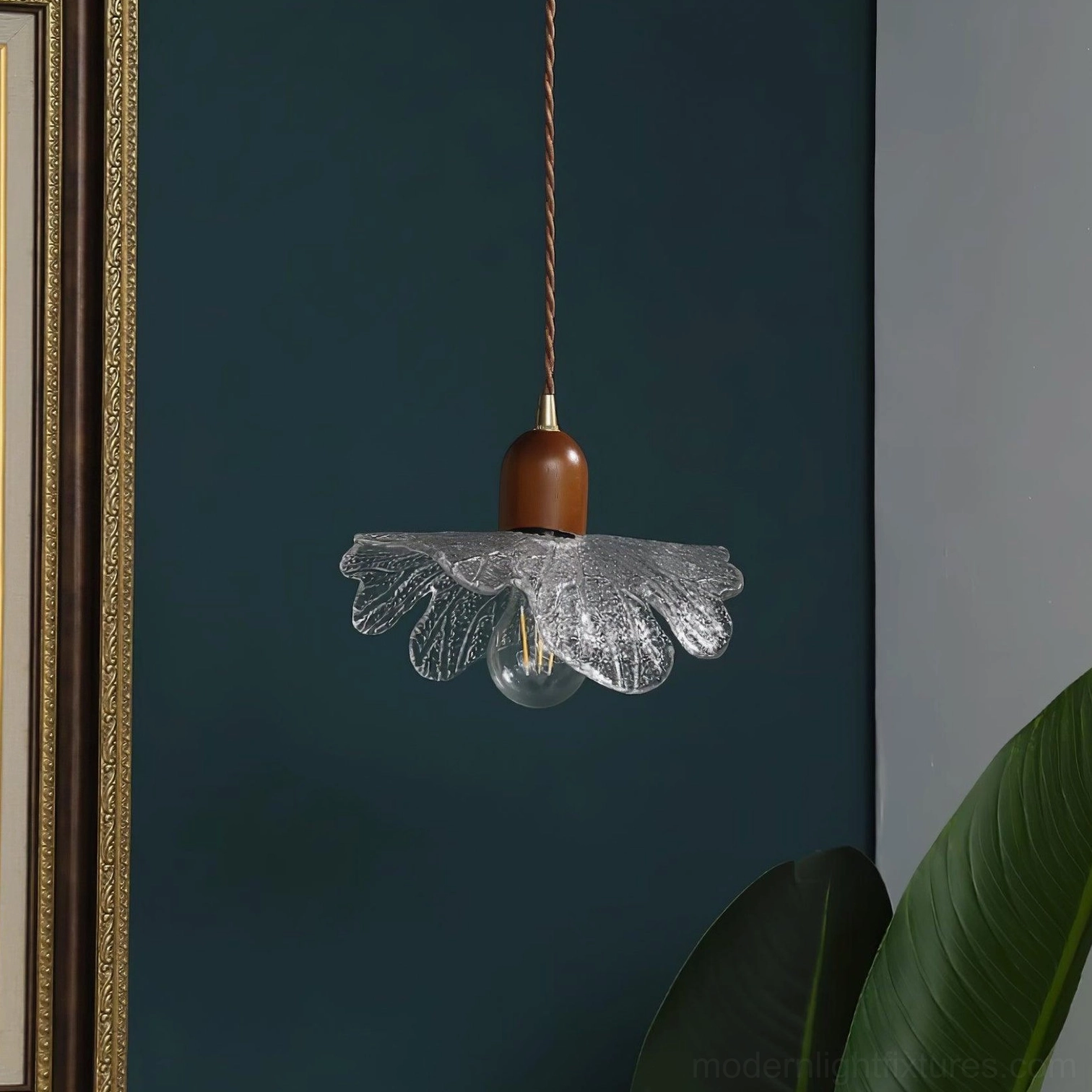 Artisanal botanical glass pendant light with brass fixture and walnut wood base detail
