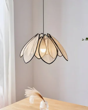 Modern petal pendant lamp installed in contemporary dining area with wooden furniture and dried pampas grass decoration