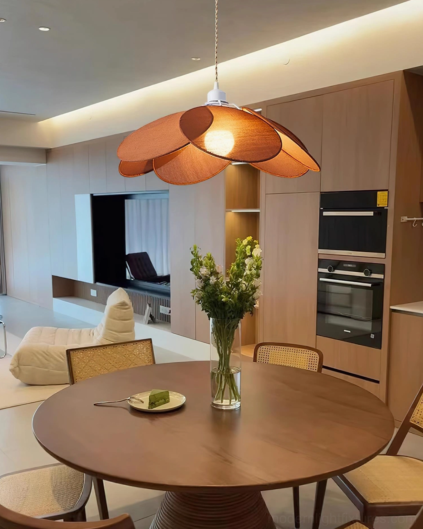 Orange-brown petal pendant light in modern kitchen dining zone with wooden interior