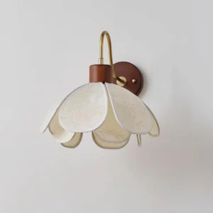 Modern petal wall light fixture showing side profile with curved brass arm and wood backplate