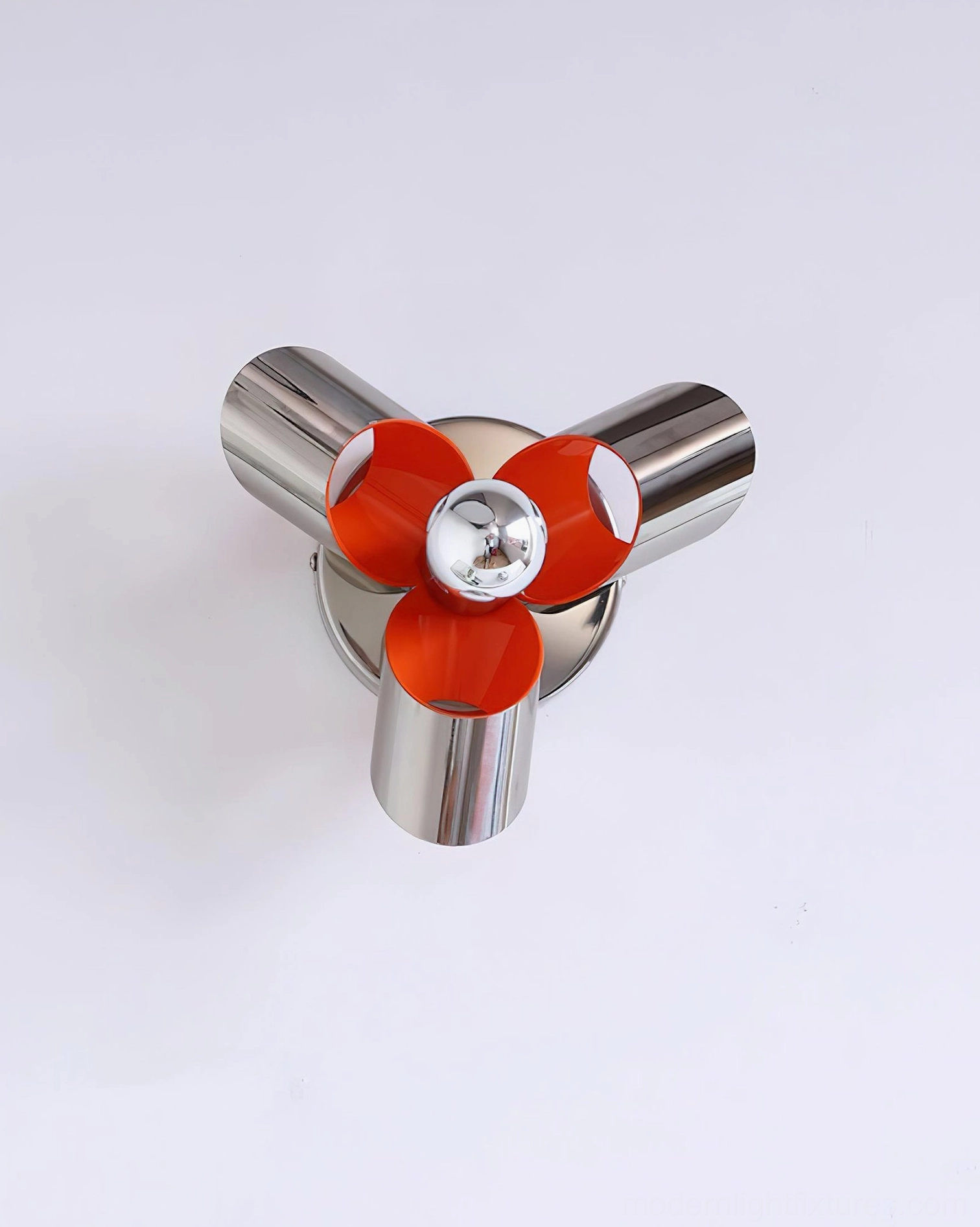 Petala chrome orange wall sconce detail closeup showcasing polished metal finish, petal geometry, and orange interior accent color