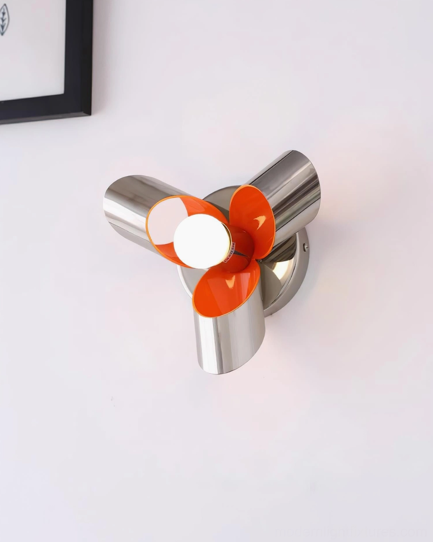 Petala wall sconce paired in hallway installation showing modern minimalist styling and sculptural floral design as statement lighting piece