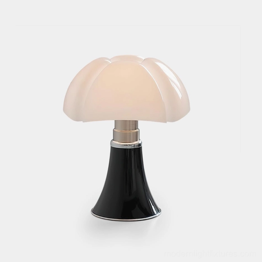 Petalica petal-style table lamp with white acrylic shade and glossy black base featuring silver metal accents, front studio view