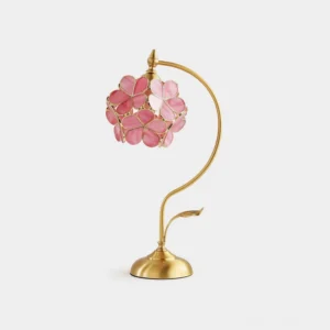 Petalora brass and stained glass table lamp front three-quarter view showing sculpted petal shade design on white background