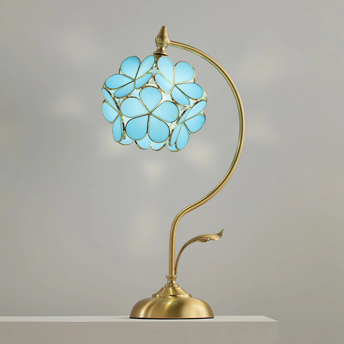 Pink Petalora stained glass table lamp on hallway console with decorative vase and botanical accessories