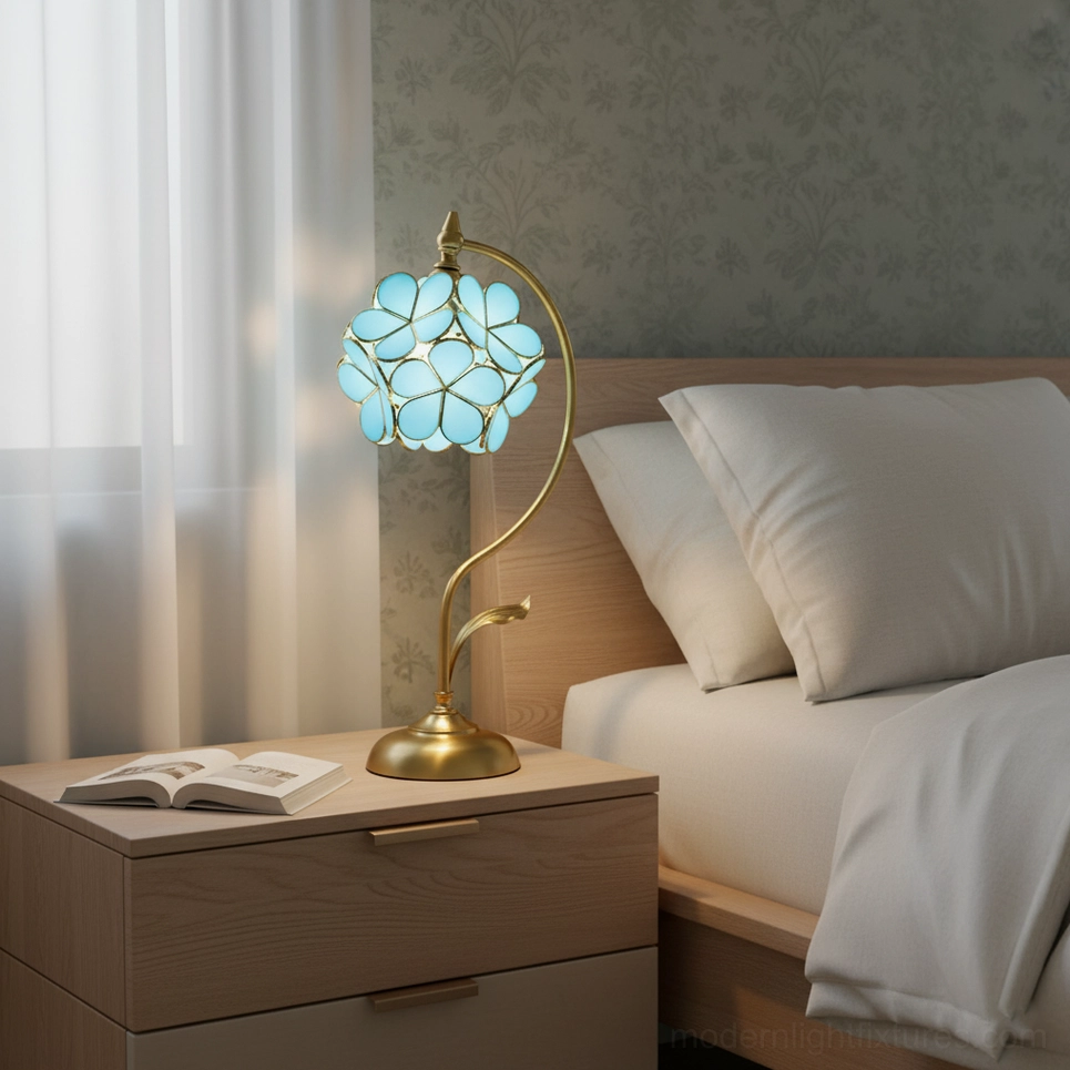 Green Petalora stained glass floral table lamp illuminated creating ambient botanical lighting atmosphere