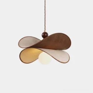 Petavin four-petal sculptural pendant light with bent walnut wood and cream linen petals, exposed warm globe bulb, front studio view