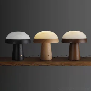 Set of three Pico Mushroom Table Lamps in mixed wood finishes displayed on wooden shelf - contemporary table lamp collection