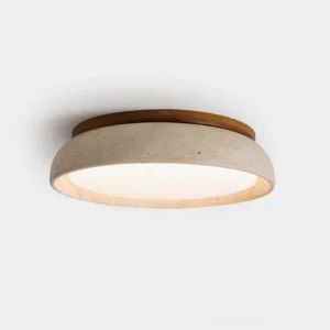 Piedra natural travertine ceiling light, front close-up view showing warm wood ring and porous stone texture on white background