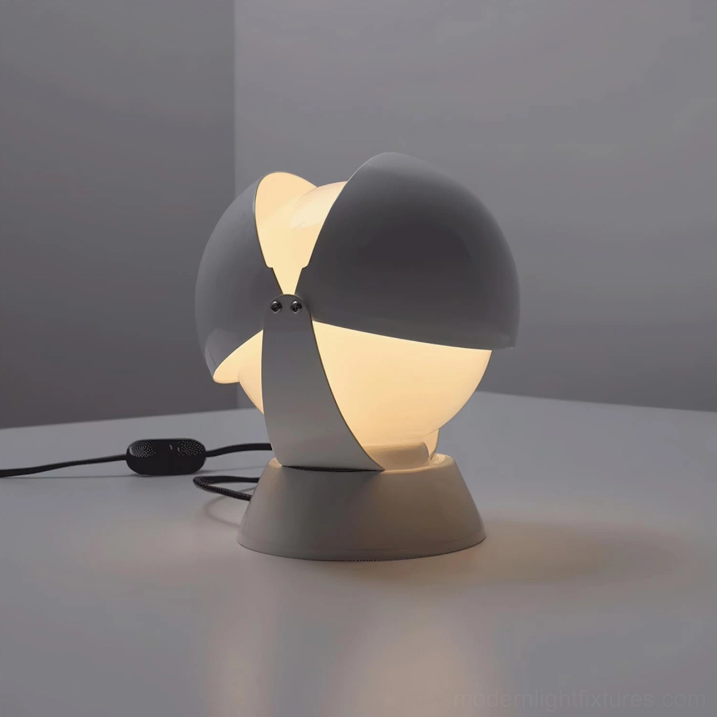 Pileino adjustable table lamp showcasing pivot mechanism and hemispherical shade design innovation