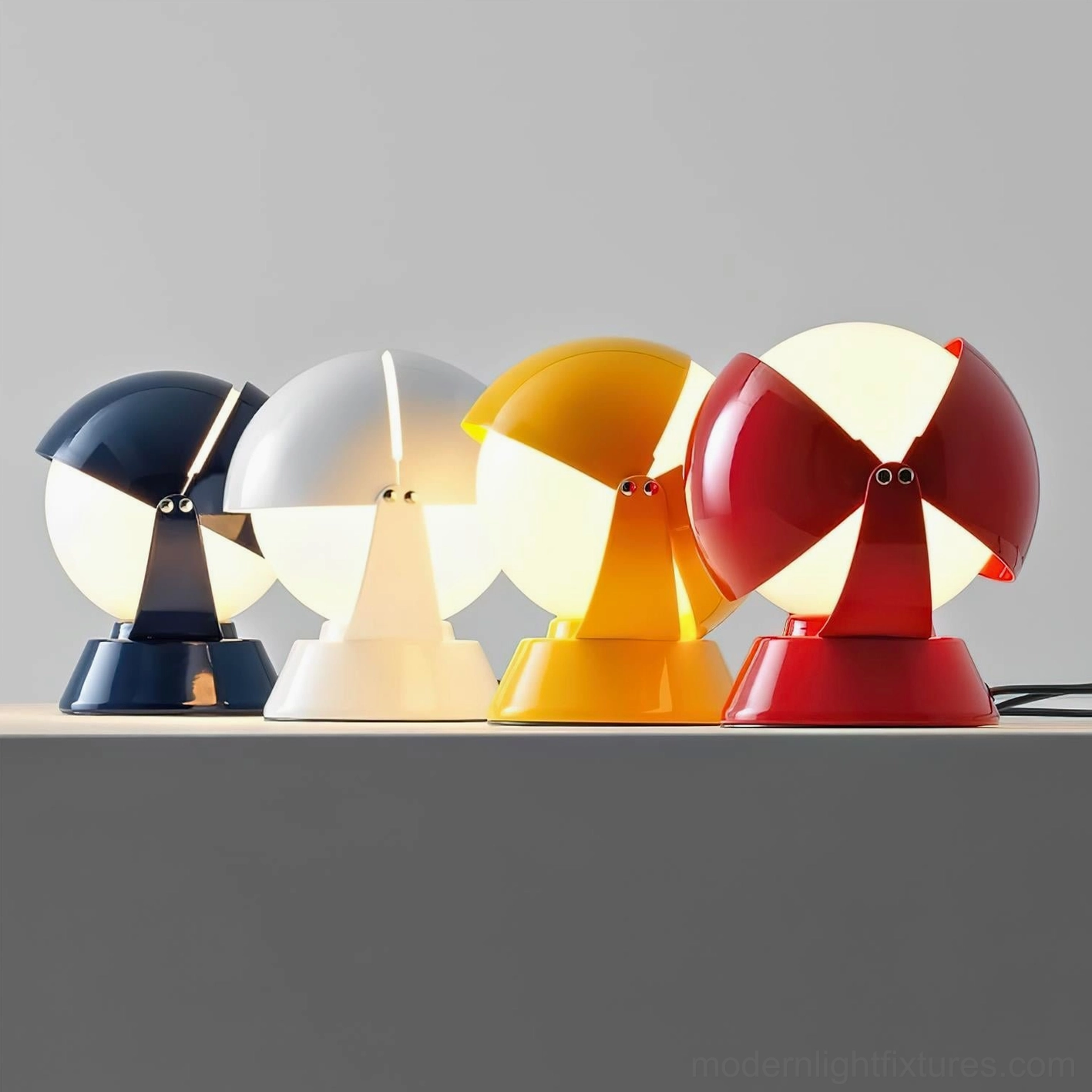 Pileino table lamp collection in four color options - navy blue, white, yellow, and red - displayed on studio shelf