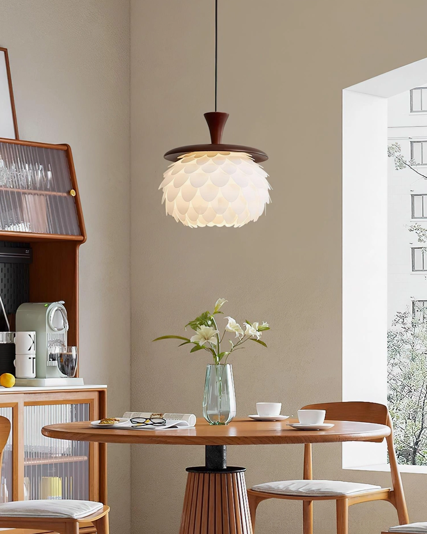Sculptural pinecone pendant light with layered white acrylic petals - close-up detail showing translucent light diffusion design