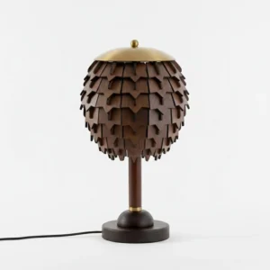 Wooden pinecone table lamp with black power cord, demonstrating cord length and push-button switch design