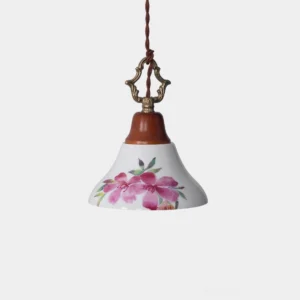 Hand-painted pink azalea ceramic pendant light with brass hardware and wooden crown detail, front view on white background
