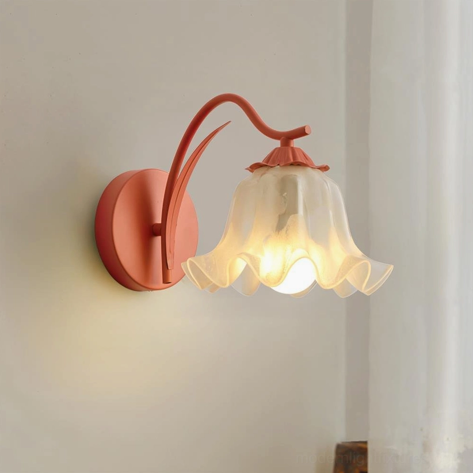 Pink lily valley wall sconce casting warm ambient light in residential bedroom