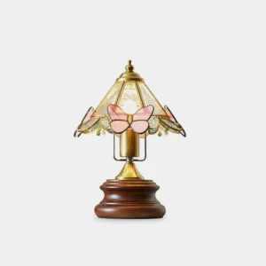 Pink butterfly stained glass table lamp with walnut wood base front view on white background