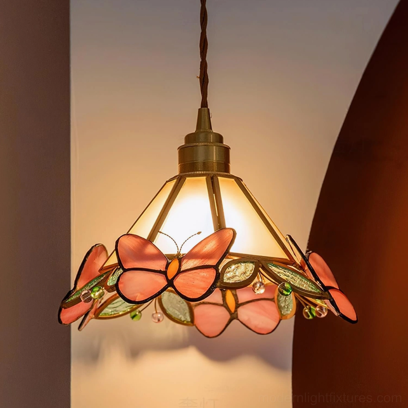 Pink Butterfly Tiffany stained glass pendant light close-up with oversized butterfly accents and brass frame