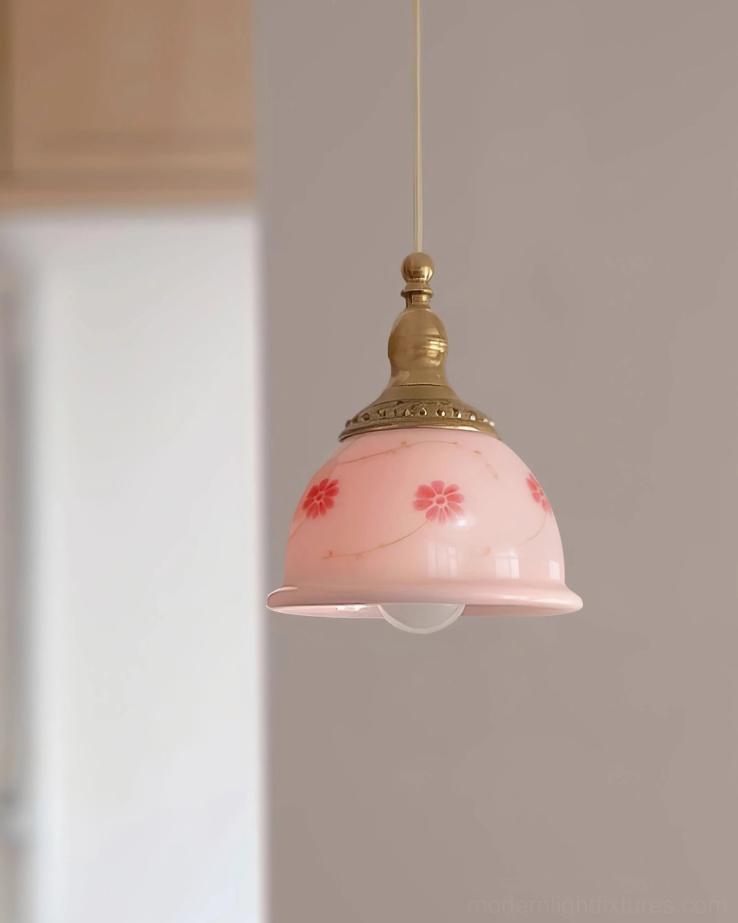 Pink ceramic bell-shaped floral pendant lamp with brass gold hardware and hand-painted botanical motifs