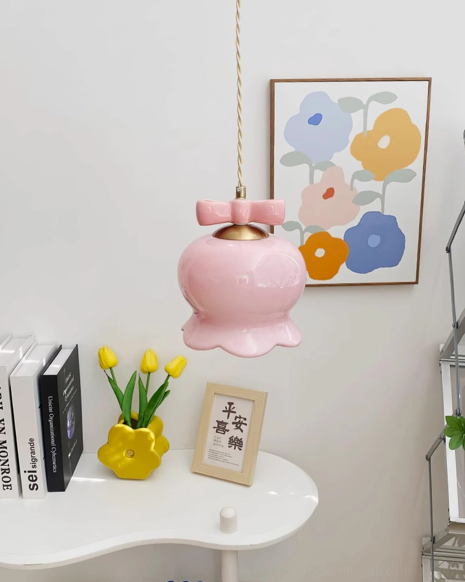 Pink ceramic pendant light fixture hanging in cozy home corner with warm interior styling