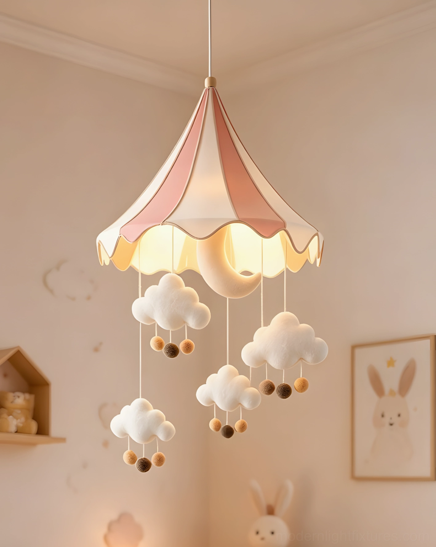 Pink circus tent pendant light with wool-felt clouds in warm blush-toned nursery bedroom